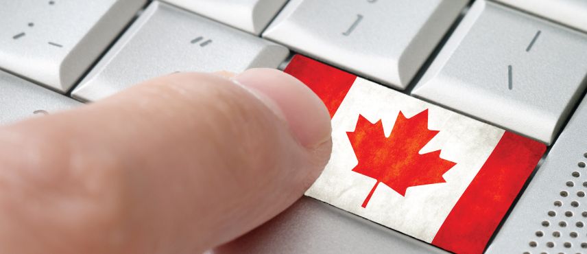 Canada flag on a keyboard - Canada Immigration